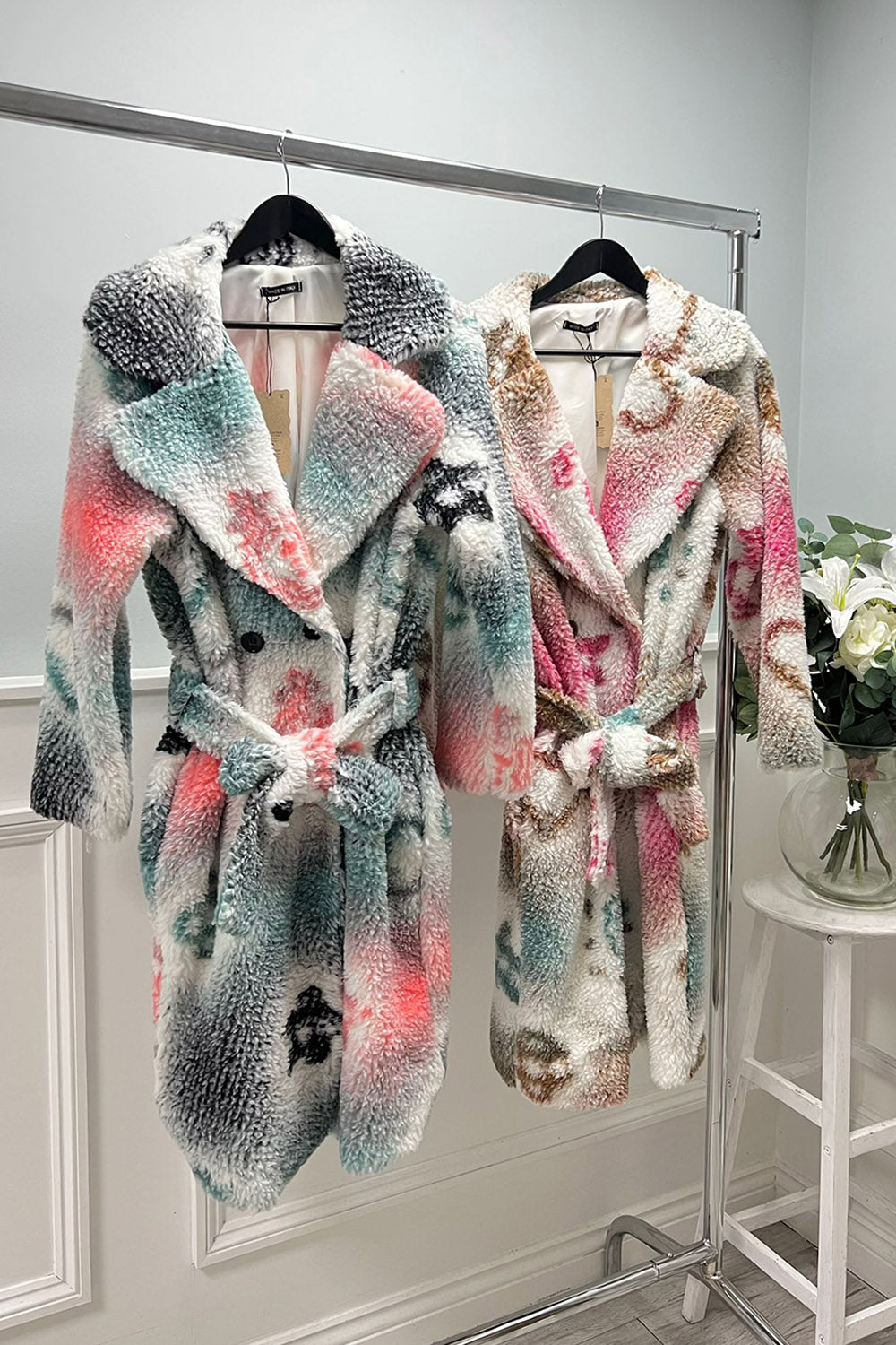 Plush, faux shearling belted coat with wide notched lapel collar, wrap-style front